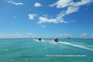 Paul Gauguin Cruises Tahiti & Society Islands Luxury Travel Virtuoso Izumi Ogawa Trip agent vacation advisor Vision French Polynesia Cruise ship boat ocean water sand beach Moorea shark stingray