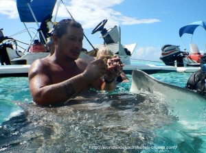 Paul Gauguin Cruises Tahiti & Society Islands Luxury Travel Virtuoso Izumi Ogawa Trip agent vacation advisor Vision French Polynesia Cruise ship boat ocean water sand beach Moorea shark stingray